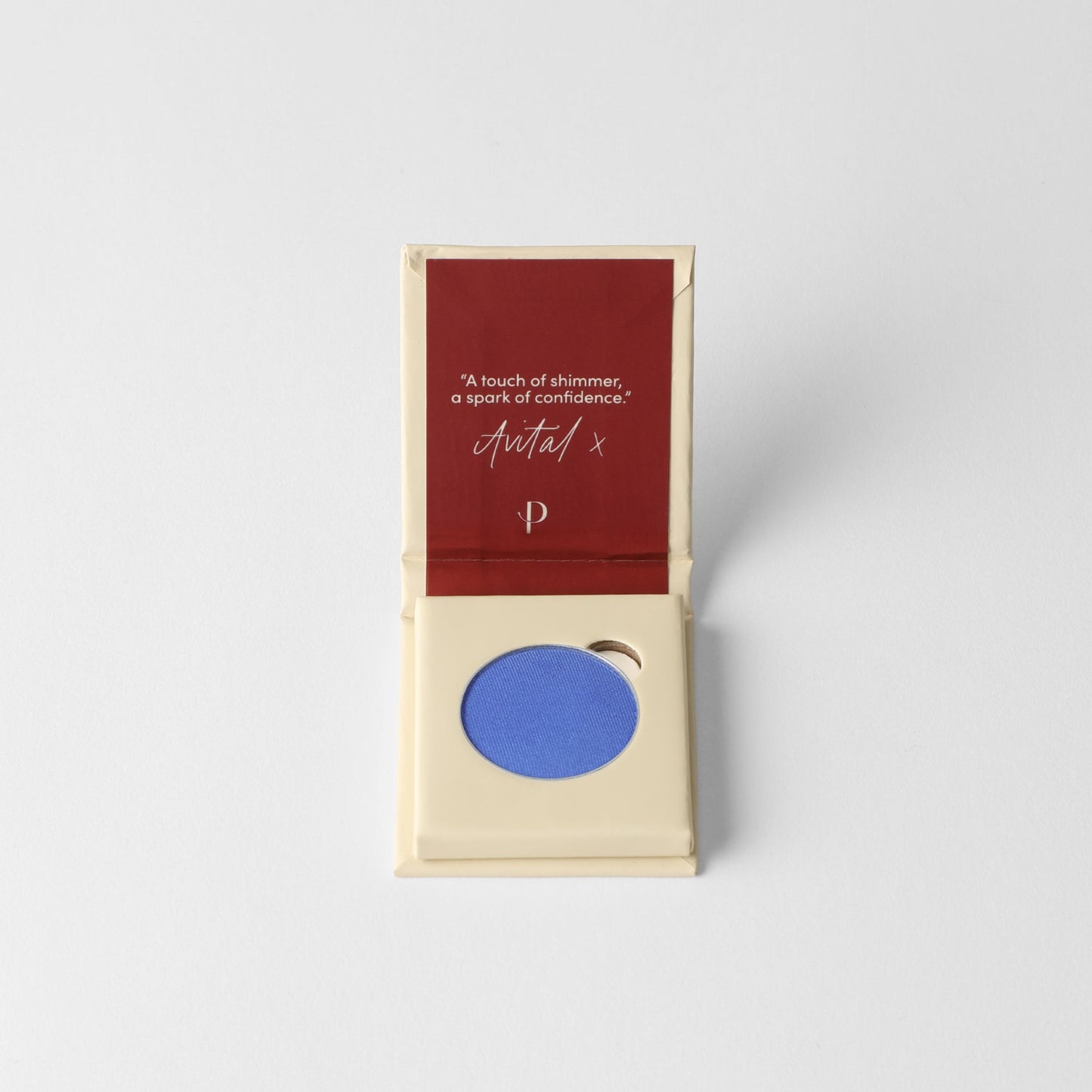 Pressed eyeshadow box with a blue eyeshadow pan inside.