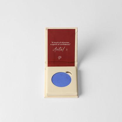 Pressed eyeshadow box with a blue eyeshadow pan inside.
