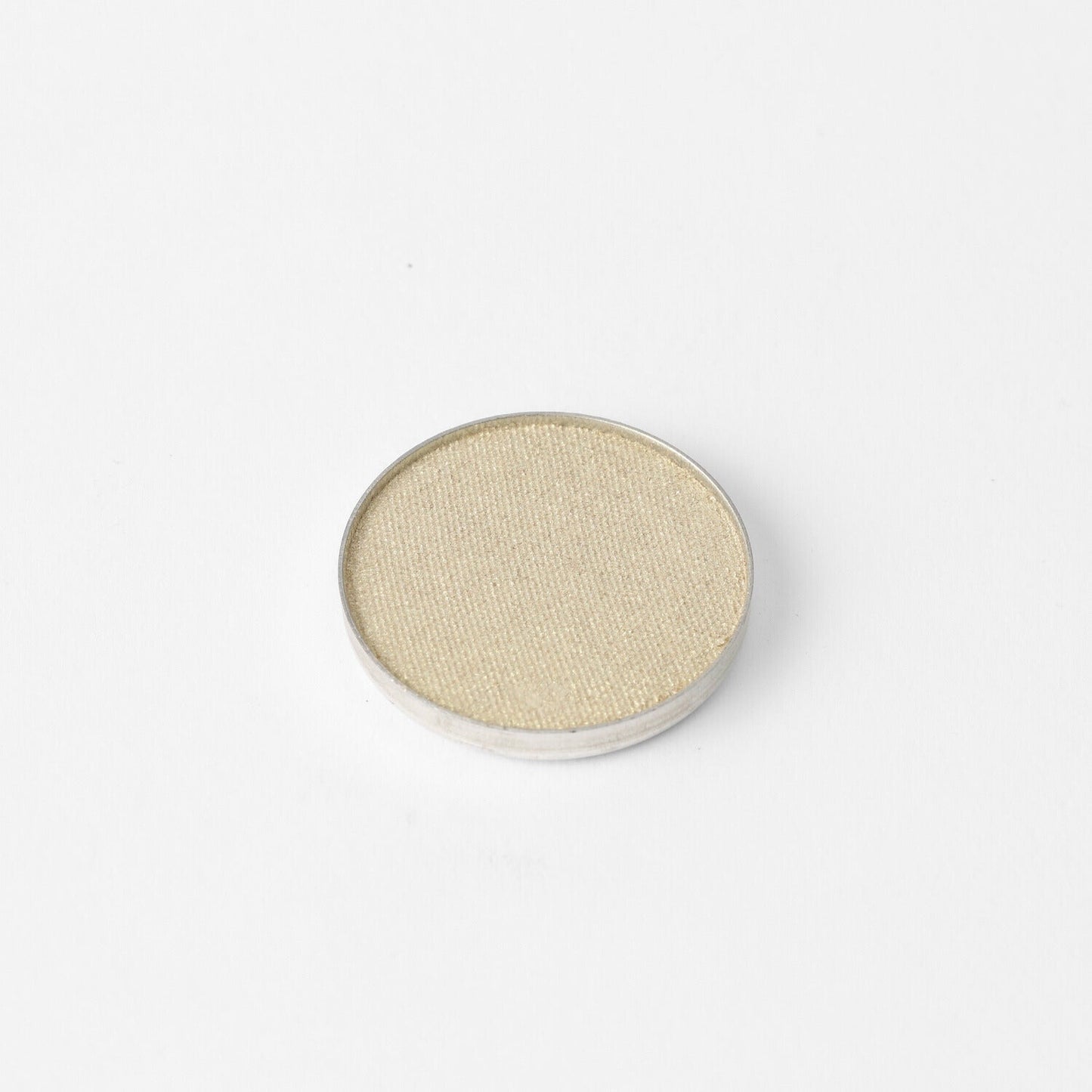 Pressed eyeshadow pan, soft gold-beige shimmer