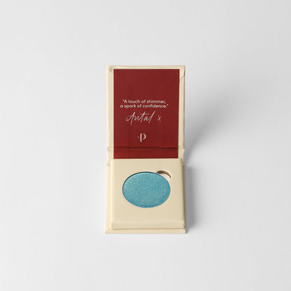 Pressed eyeshadow set with teal-blue oval pan inside beige box