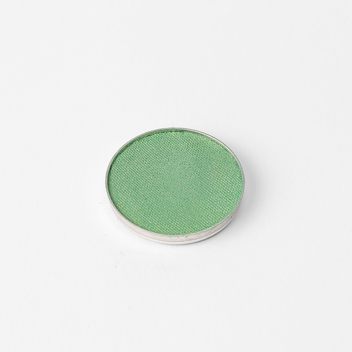 Pressed eyeshadow pan, bright green shimmer finish