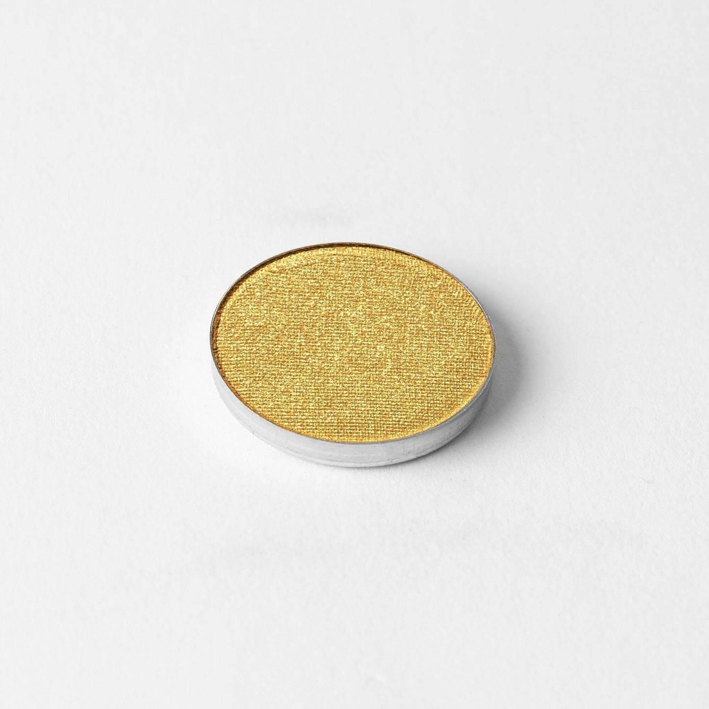 Pressed eyeshadow pan, metallic gold