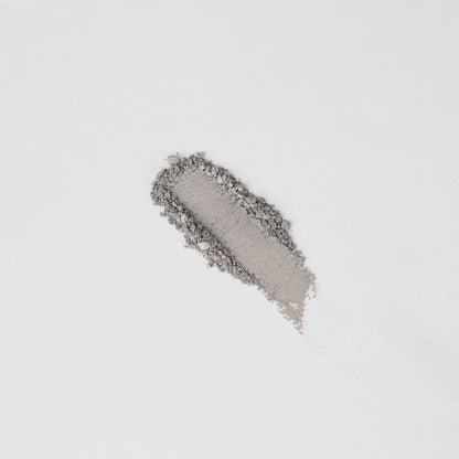 Shimmering light gray eyeshadow swatch on skin