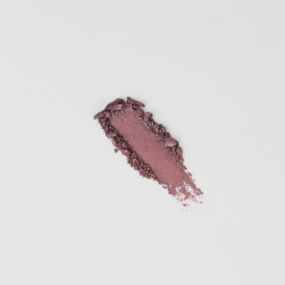 Pressed eyeshadow swatch, rosy mauve shimmer