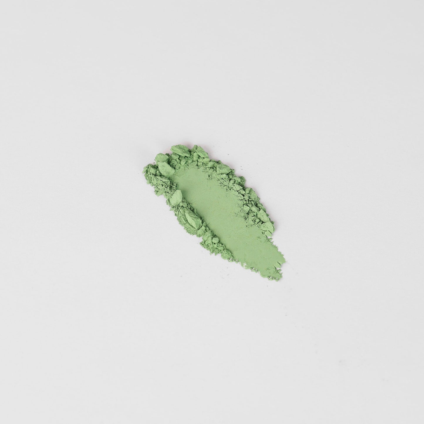 Pressed eyeshadow swatch, bright green shimmer
