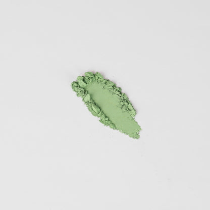 Pressed eyeshadow swatch, bright green shimmer