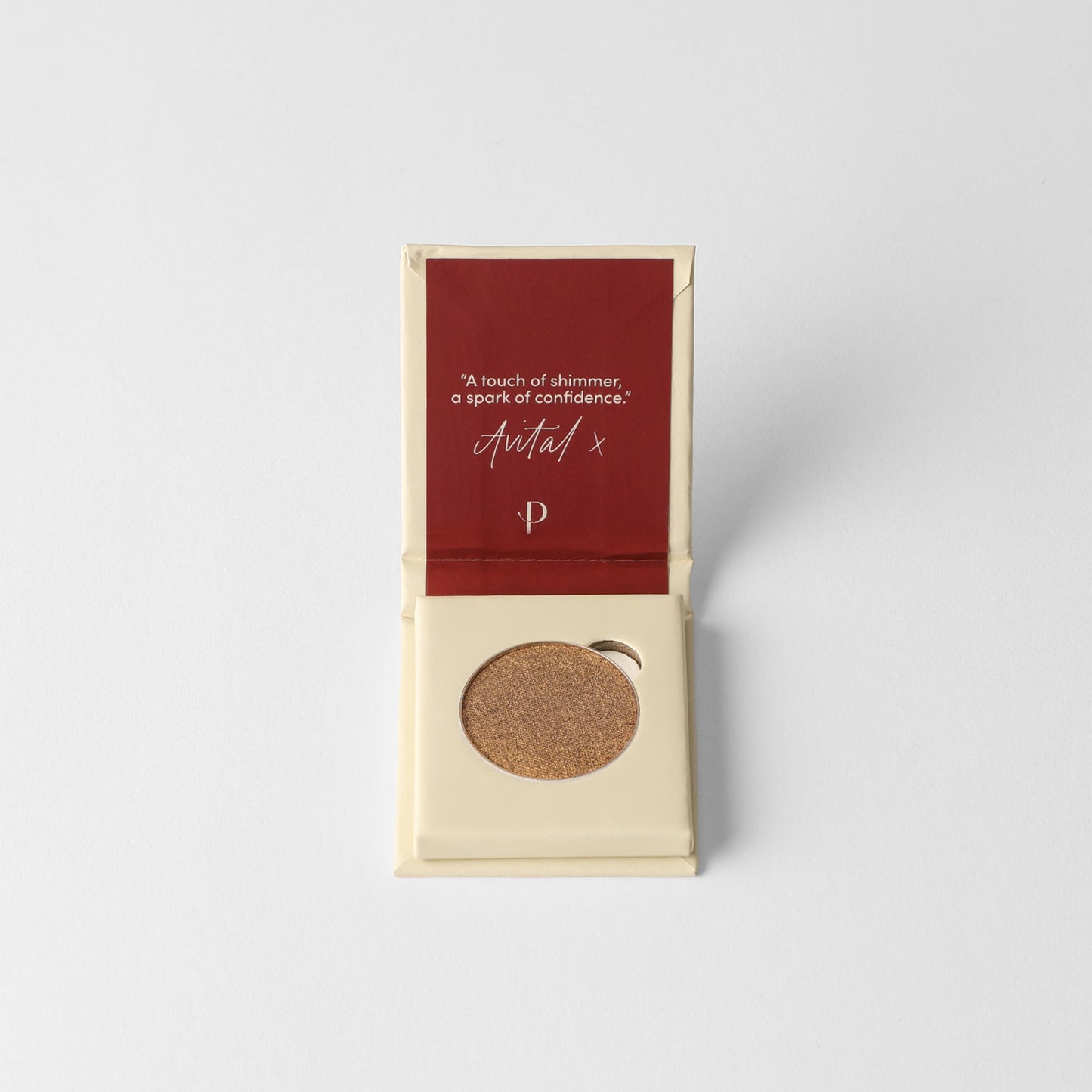 Pressed eyeshadow compact with deep brown shimmer pan, shown open