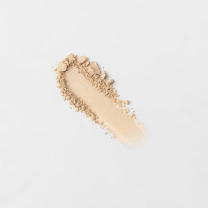 Swatch of light beige pressed eyeshadow with subtle shimmer