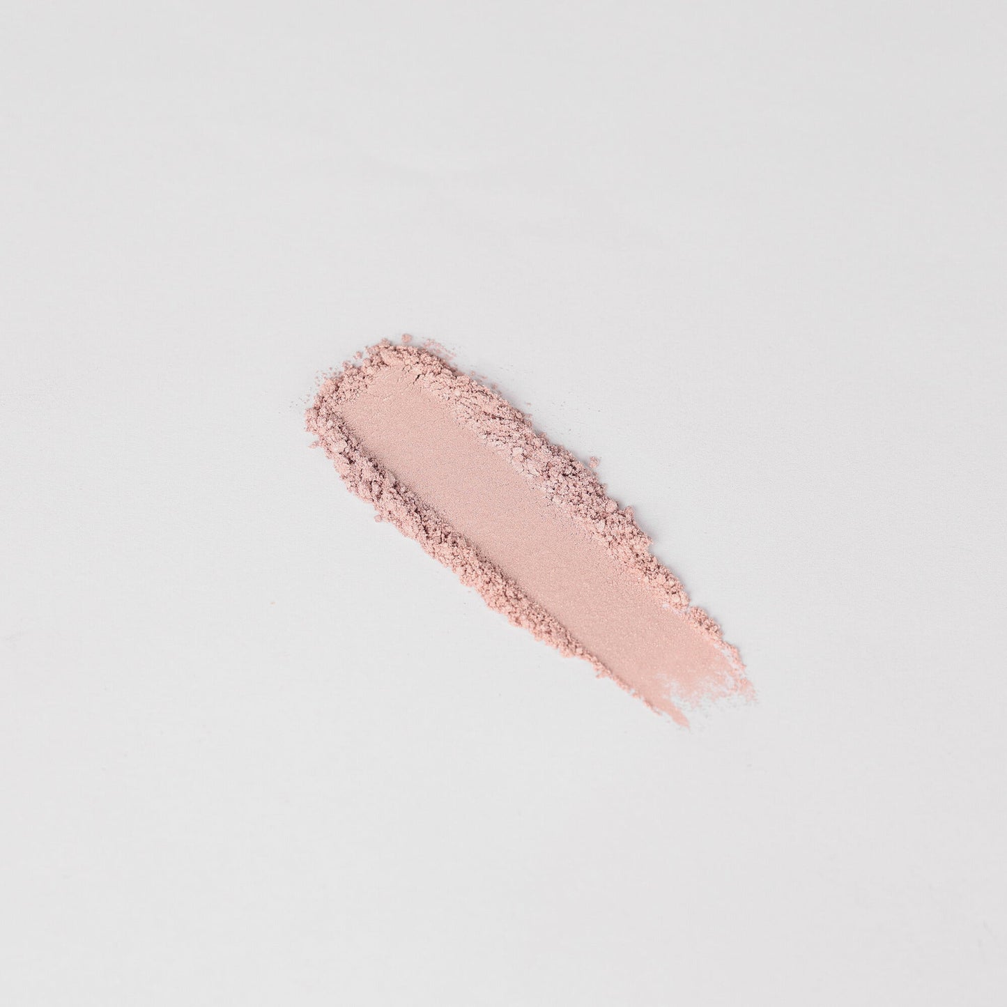 Pink shimmer eyeshadow swatch stripe with visible powder texture.