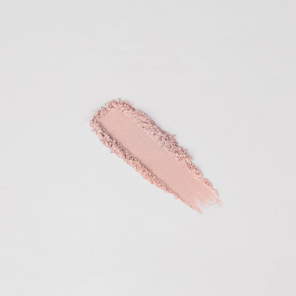 Pink shimmer eyeshadow swatch stripe with visible powder texture.