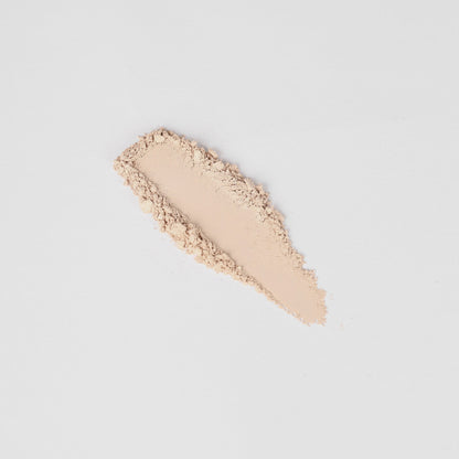 Pressed eyeshadow swatch, pale beige shimmer stripe