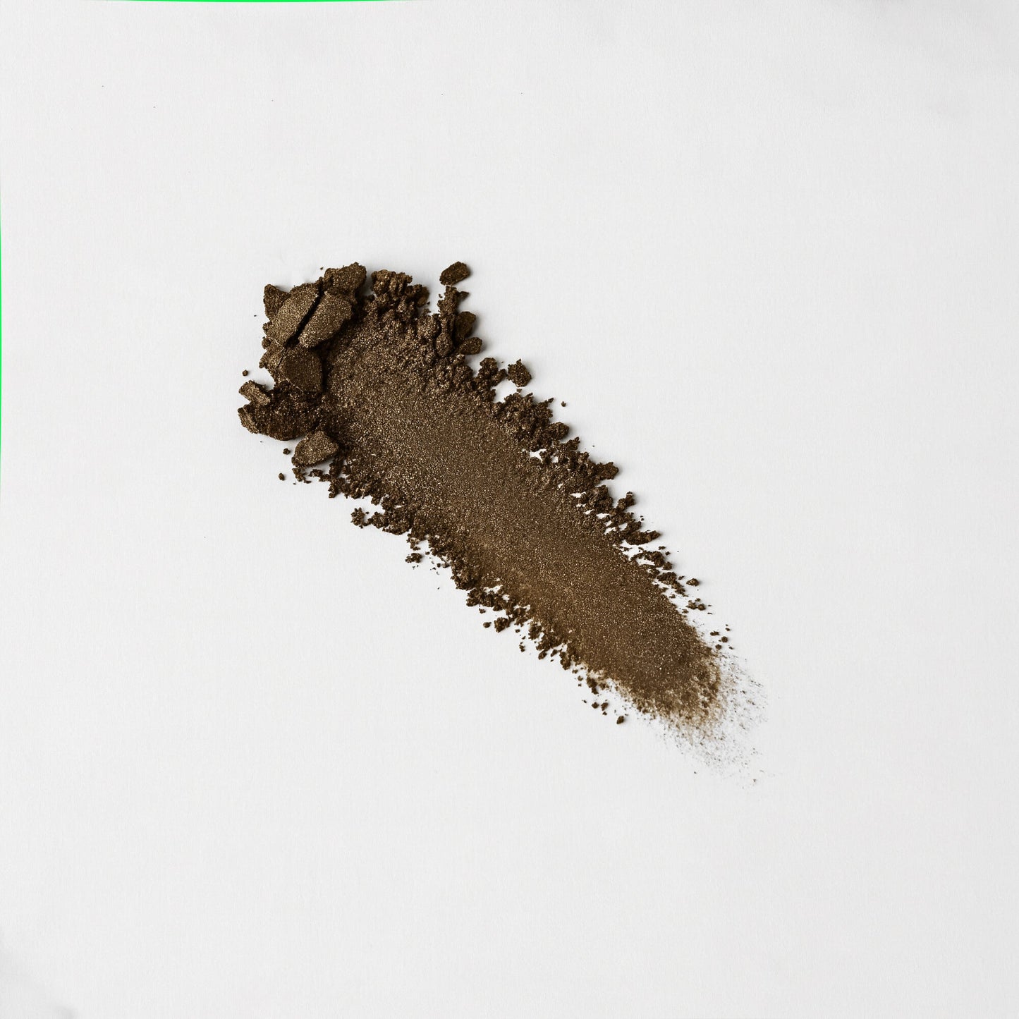 Pressed eyeshadow swatch, bronze brown glittery finish