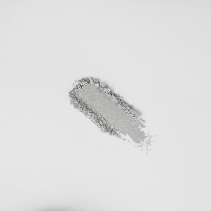 Shimmering silver-gray eyeshadow swatch on skin