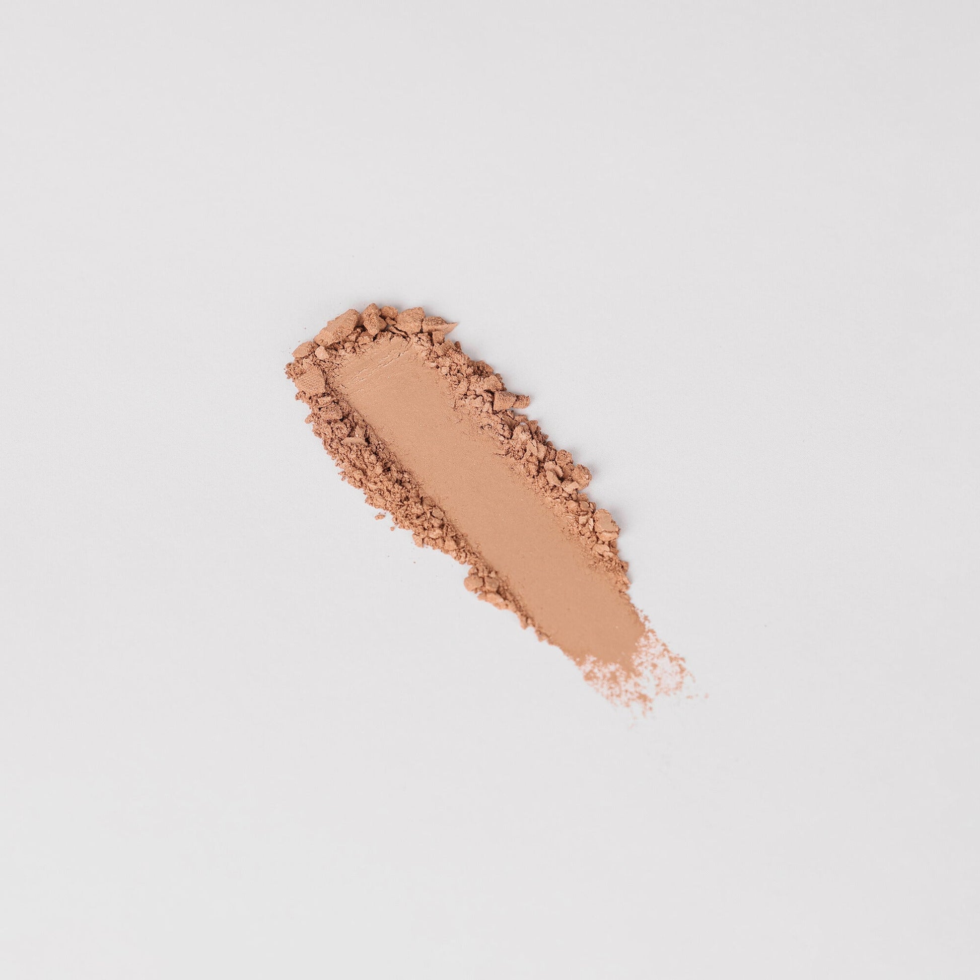 Peach nude shimmer eyeshadow swatch stripe, textured powder deposit.