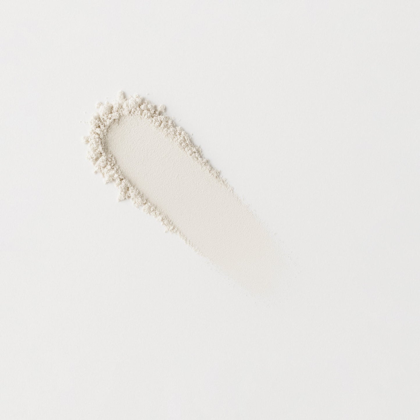 Long swatch of light neutral pressed eyeshadow with fine shimmer