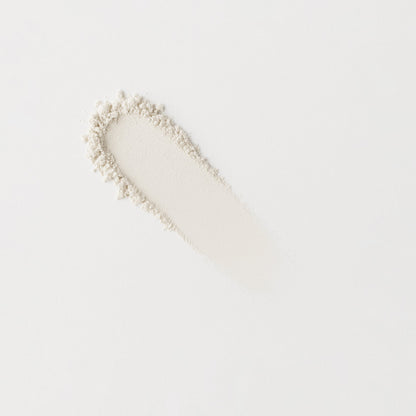Long swatch of light neutral pressed eyeshadow with fine shimmer