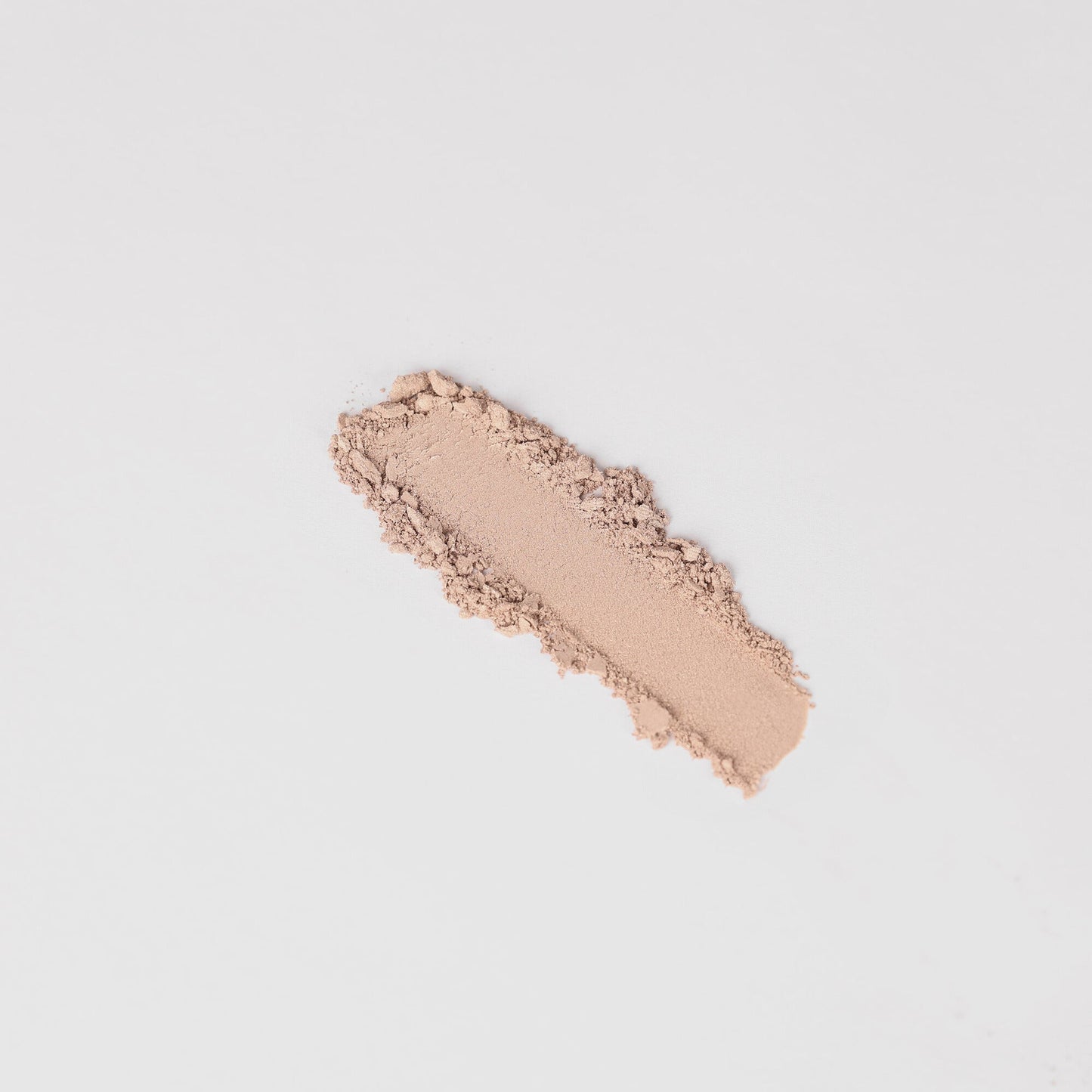 Peach nude shimmer eyeshadow swatch stripe with powdery texture.