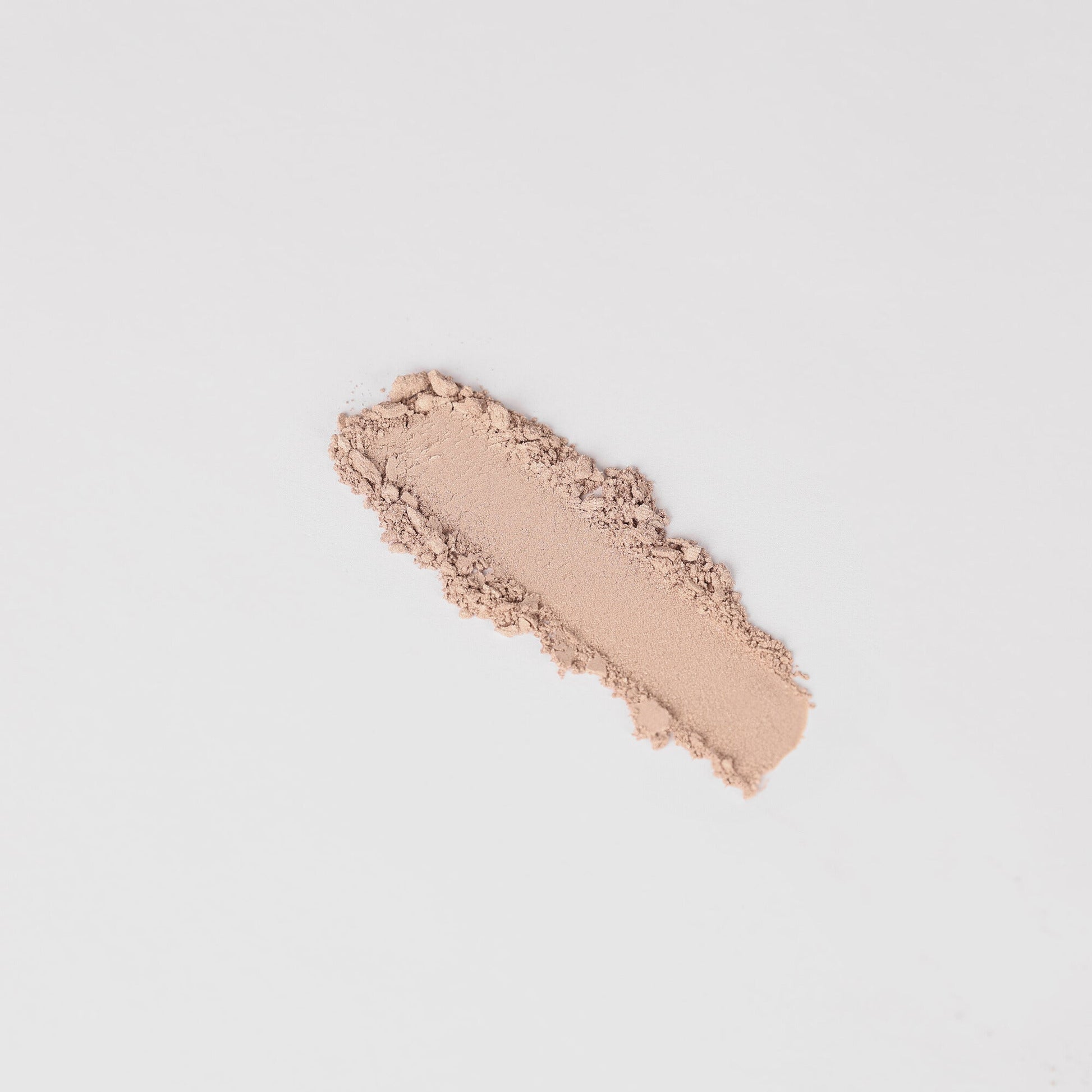 Peach nude shimmer eyeshadow swatch stripe with powdery texture.
