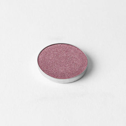 Pressed eyeshadow pan, shimmering dusty rose