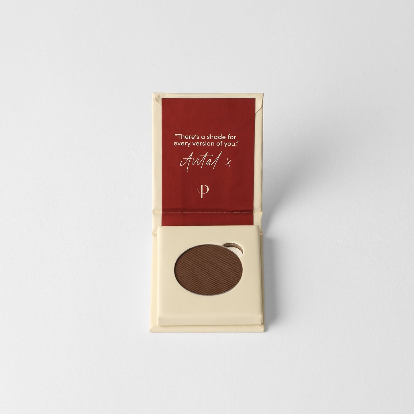 Matte pressed eyeshadow pan in box, dark brown shade