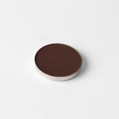 Pressed eyeshadow pan, dark brown round compact