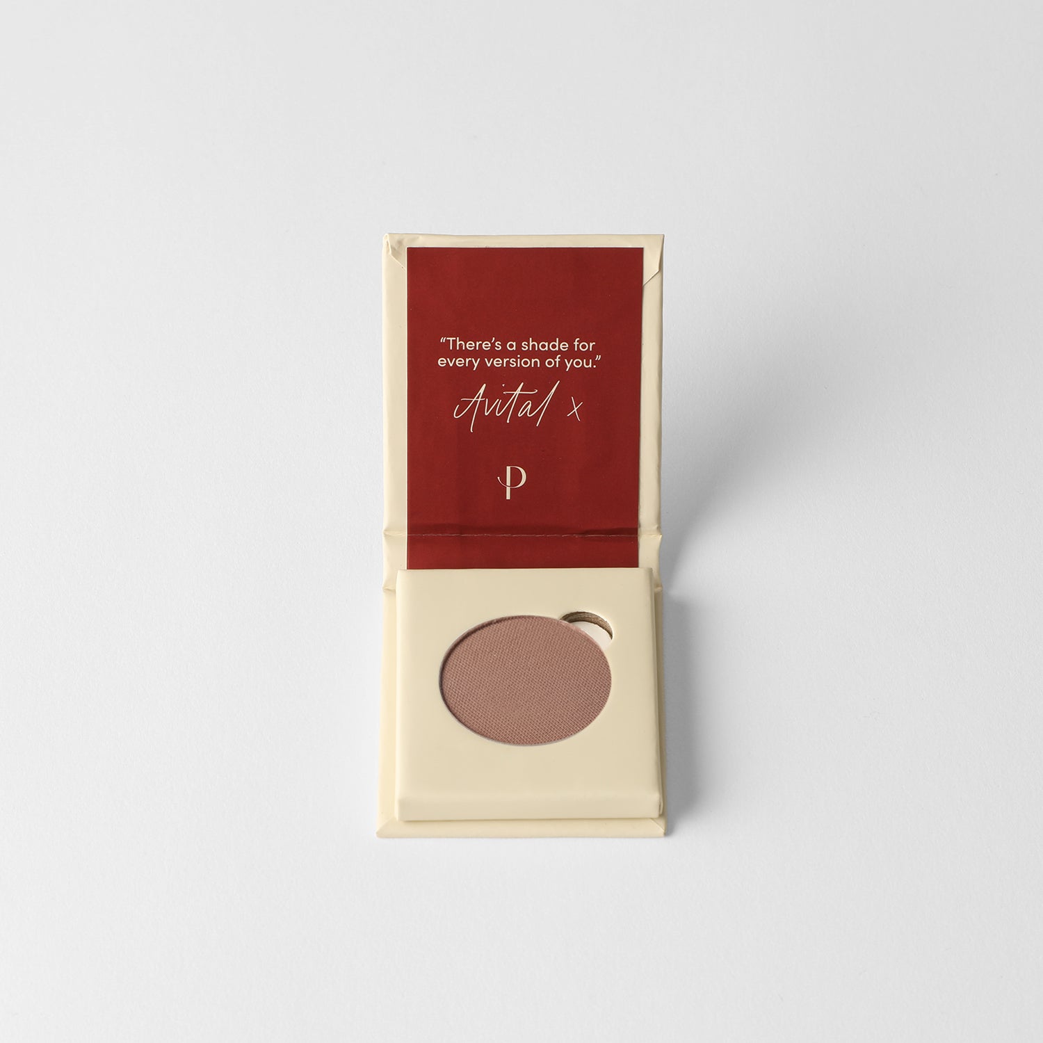 Matte pressed eyeshadow in compact with dark taupe pan