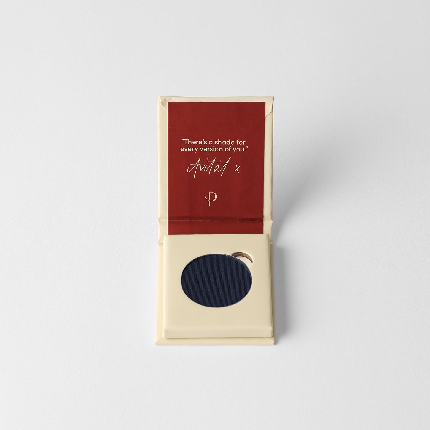 Matte pressed eyeshadow in cardboard box, round navy-blue pan