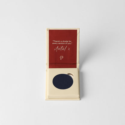 Matte pressed eyeshadow in cardboard box, round navy-blue pan