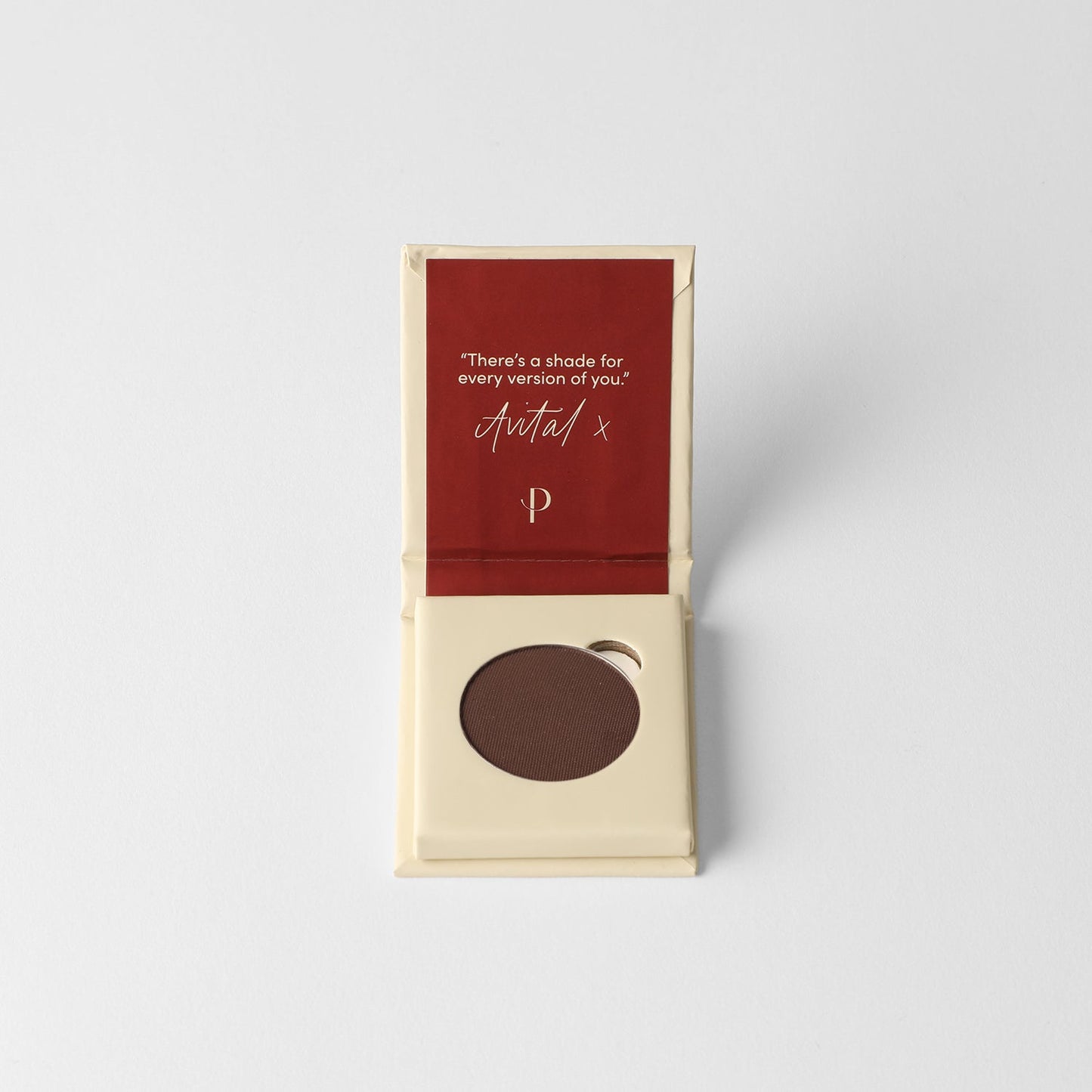 Matte pressed eyeshadow pan in box, dark brown shade