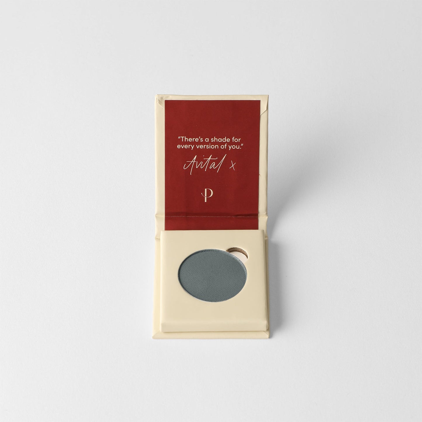 Matte pressed eyeshadow in cardboard box, round gray-green pan