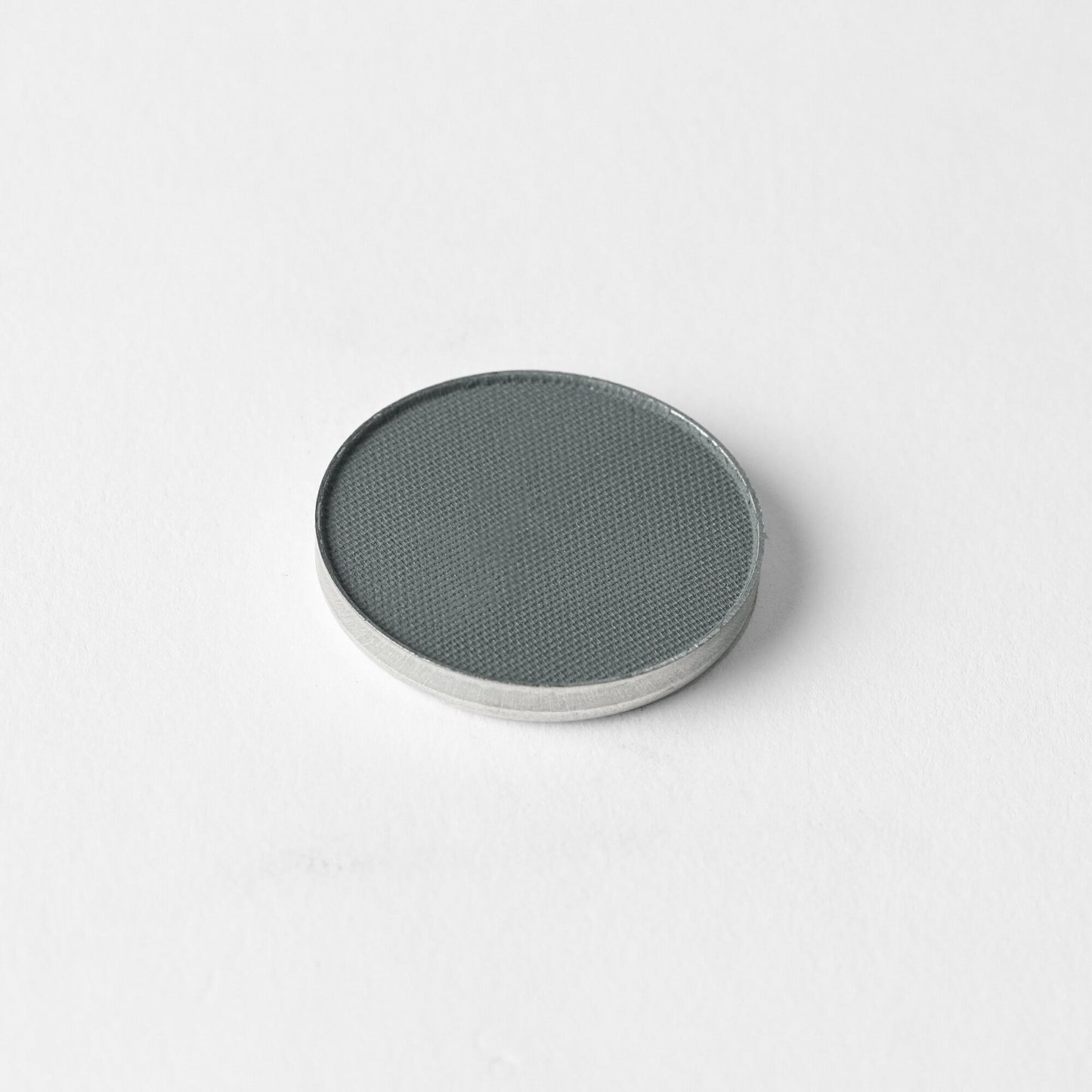 Matte pressed eyeshadow compact, muted slate-green pan