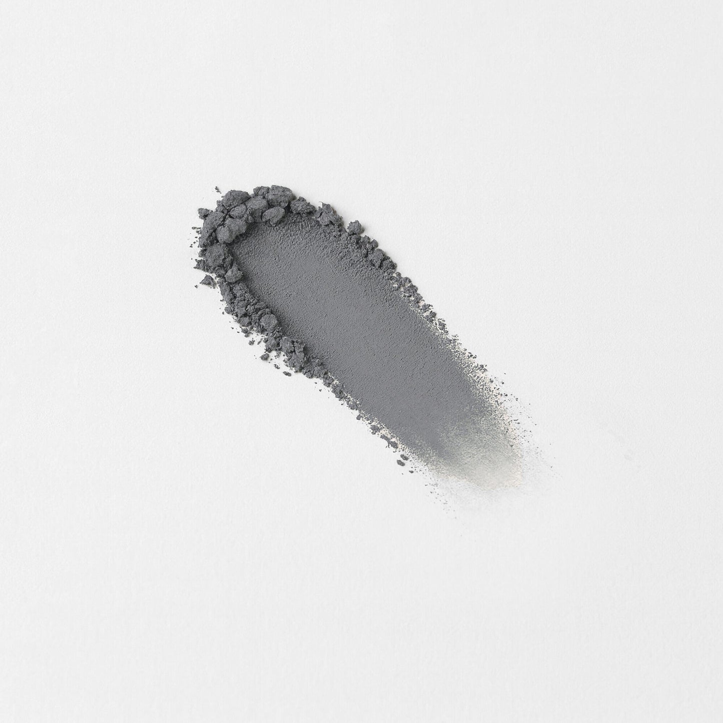 Matte pressed eyeshadow swatch, dusty gray streak on skin