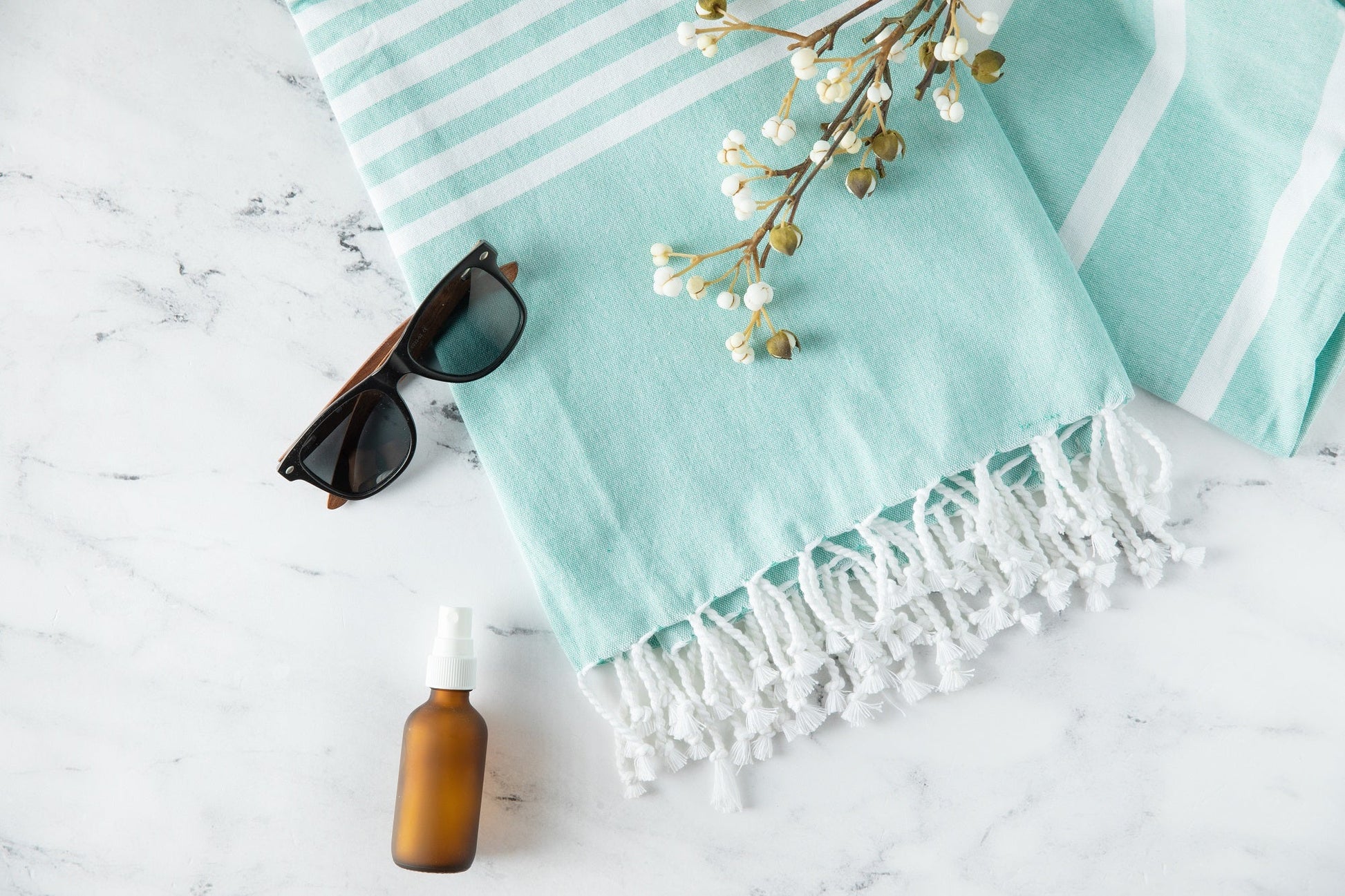 Turkish beach towel, light aqua with white stripes and tassel fringe