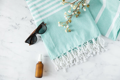 Turkish beach towel, light aqua with white stripes and tassel fringe