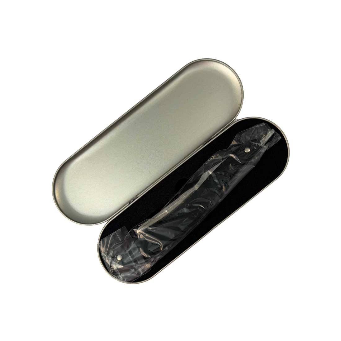 Opened silver razor case with black lining and razor inside