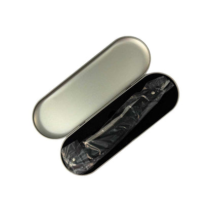 Opened silver razor case with black lining and razor inside