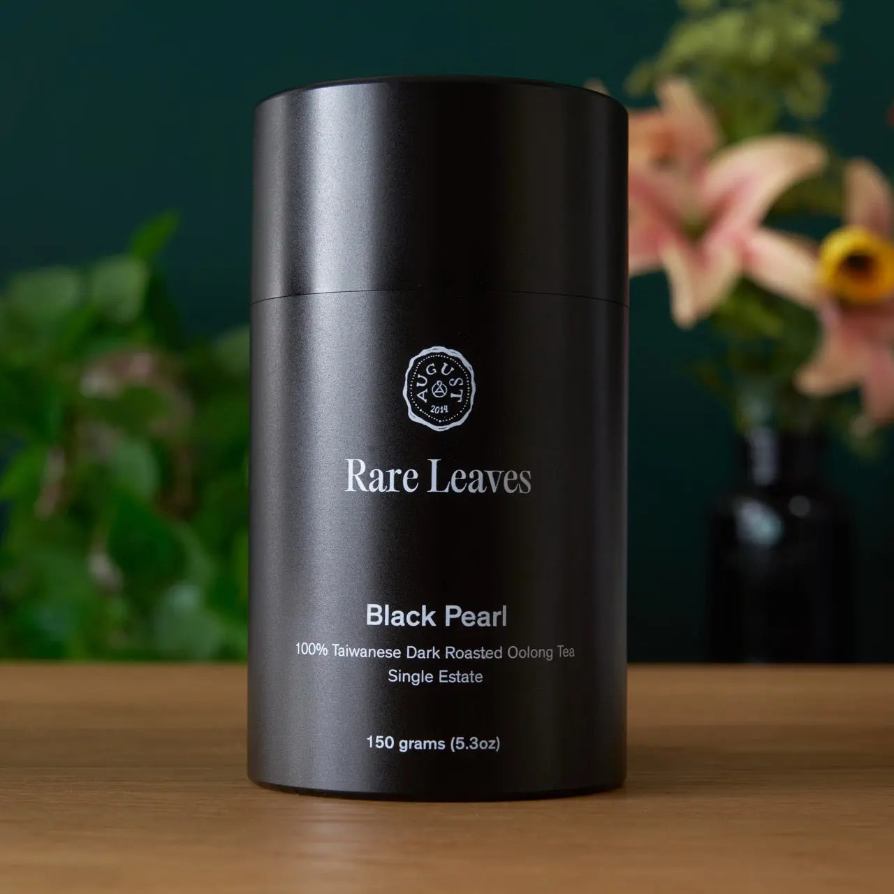 Black Pearl tea canister, matte black cylinder with Rare Leaves logo and Black Pearl details
