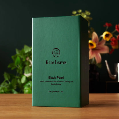 Black Pearl Taiwanese oolong tea box, green and black with Rare Leaves label