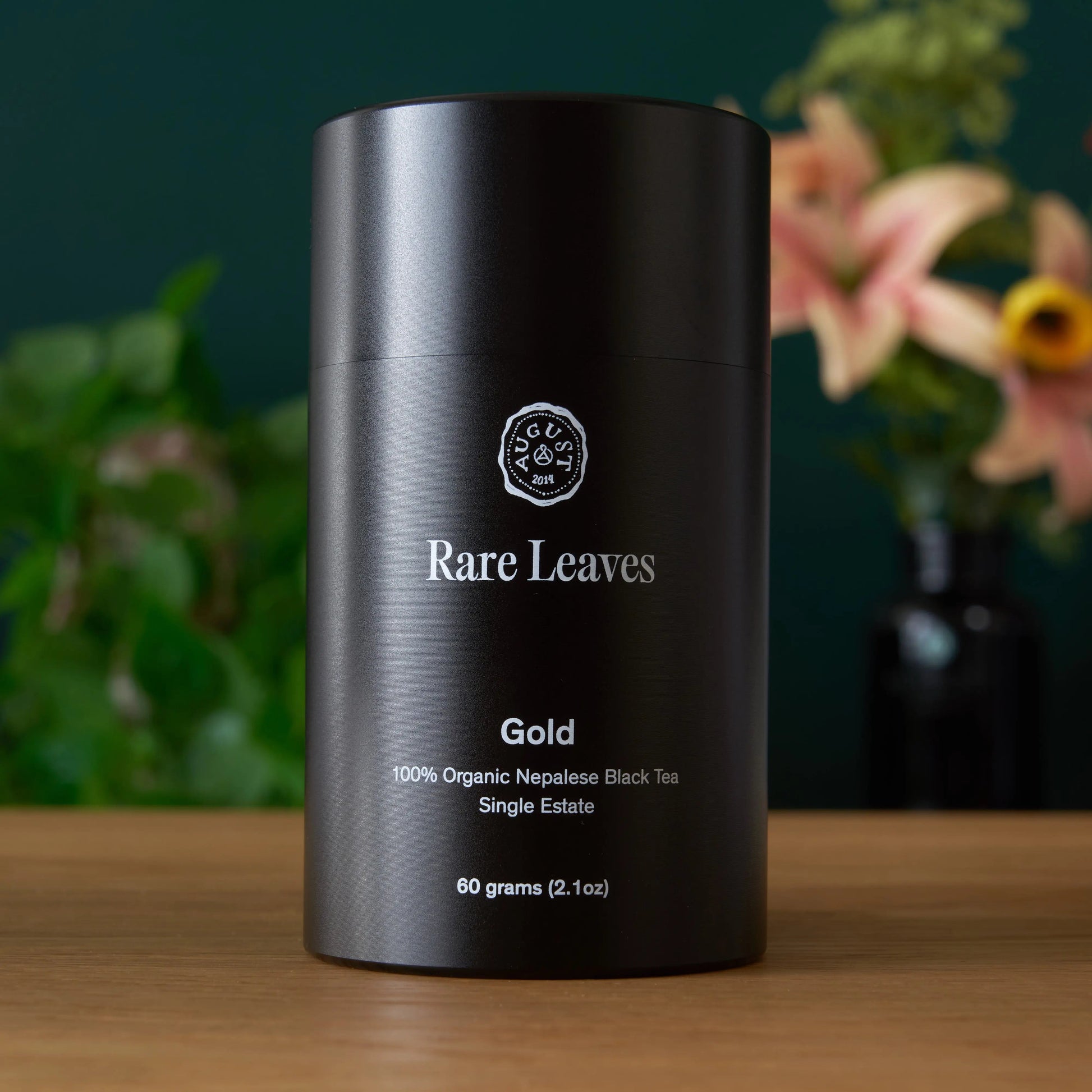Gold black tea tin, black canister with Rare Leaves branding