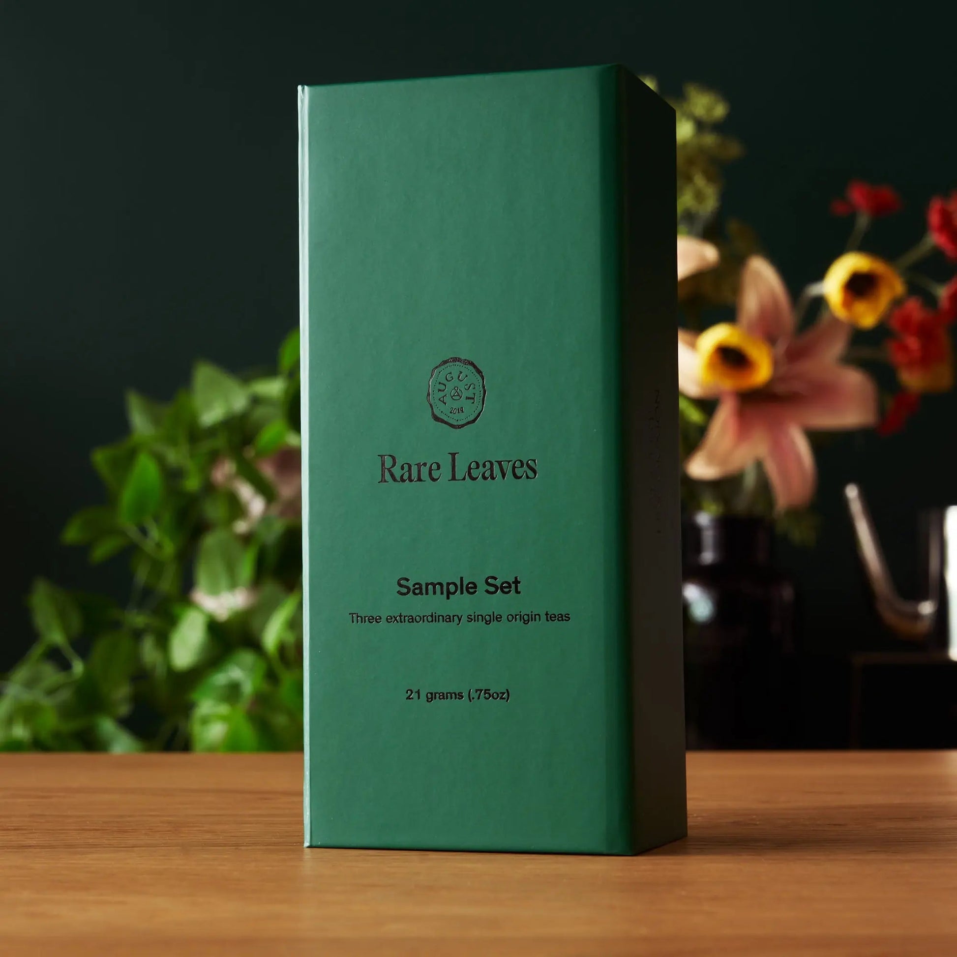 Tea sampler box with Rare Leaves branding, mini tin set, green package.
