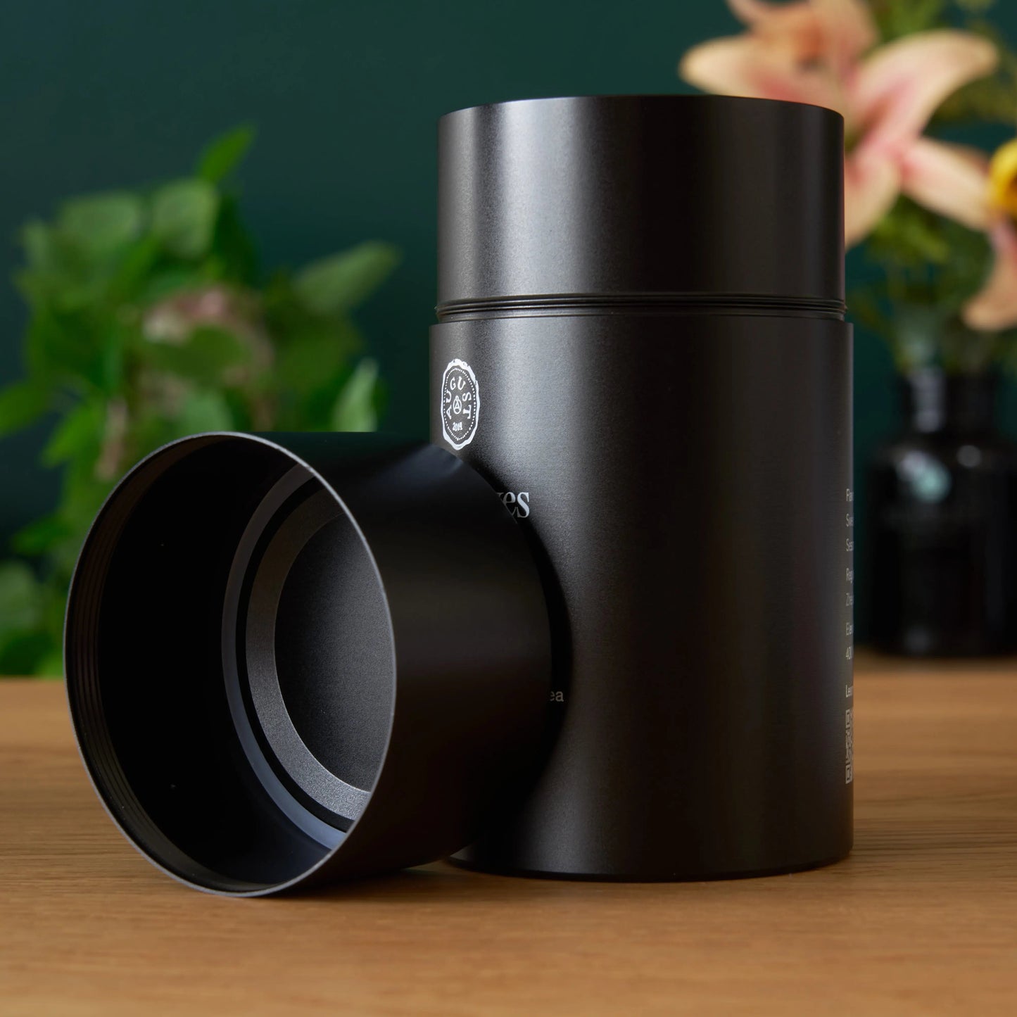 Black Pearl oolong tea canister with open lid on side