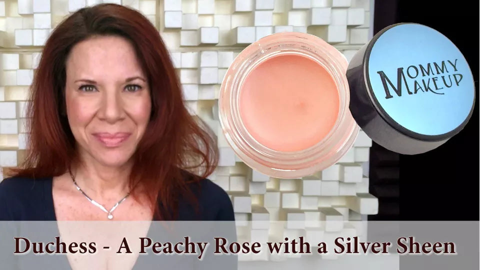 Cream-to-powder pigment jar in peachy rose with silver sheen, open lid
