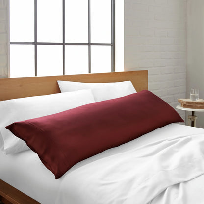 Bamboo body pillowcase in ruby red, lying on a white bed sheet