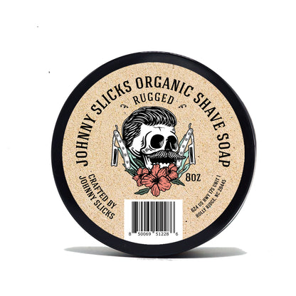 Organic shave soap tin, black rim with 'Rugged' label and skull-and-flowers graphic