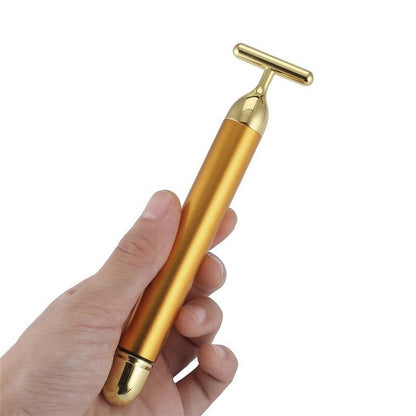 Handheld gold T-shaped facial roller massager with cylindrical handle