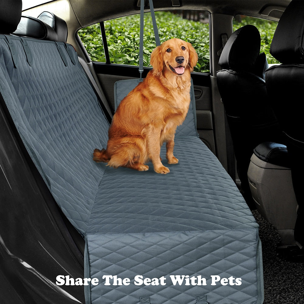 Grey quilted dog car seat cover with raised bolster and secure attachment straps