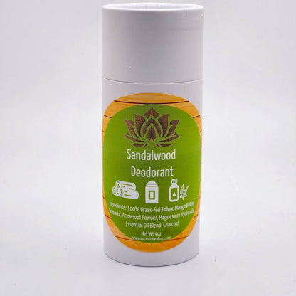 Tallow deodorant stick labeled Sandalwood with a green-yellow label and lotus icon.