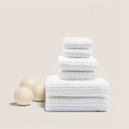White waffle cotton towel stack with folded edges, textured waffle weave