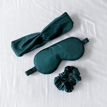 Bamboo sleep care set with dark teal eye mask, headband, matching scrunchie