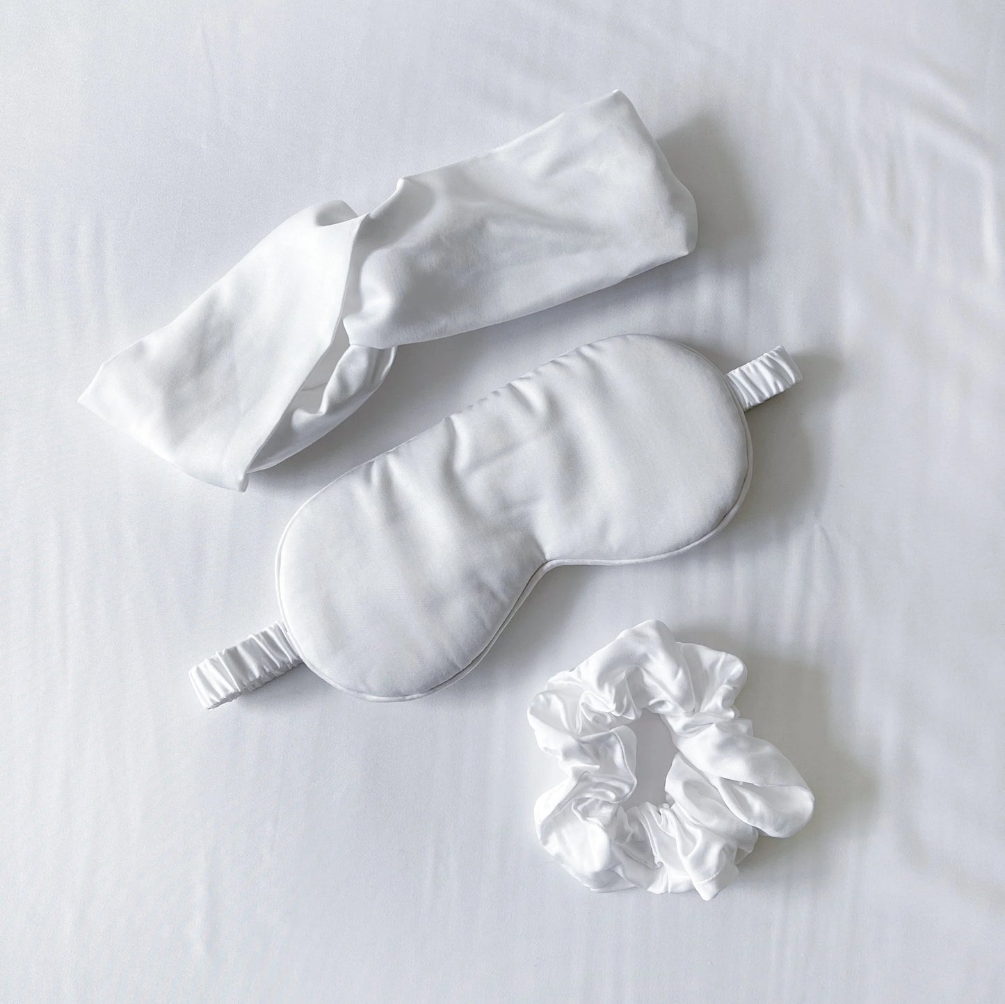 Bamboo sleep care set with white eye mask, white headband, matching scrunchie